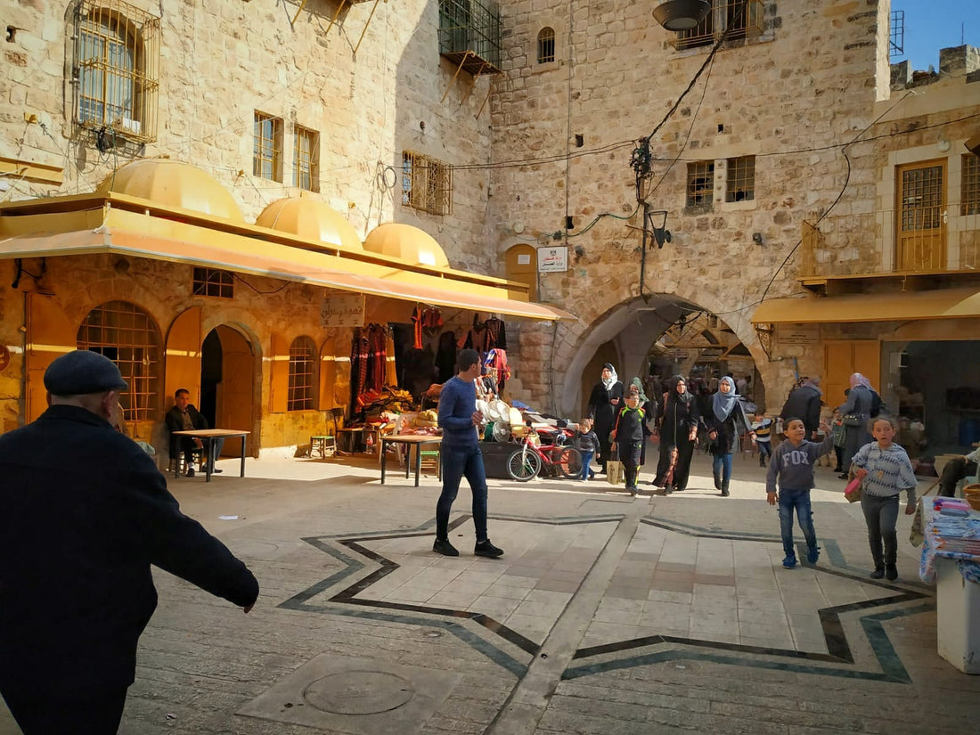 The covered souk of Hebron old city, with stone arches and traditional market stalls, West Bank, Palestine
