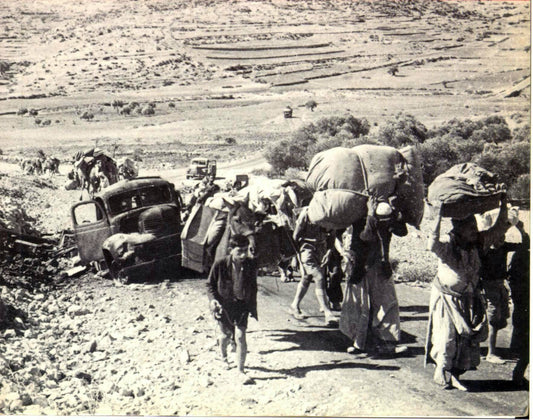 Palestinian refugees carrying belongings during the 1948 Nakba, displacement that gave rise to the Key of Return as a symbol