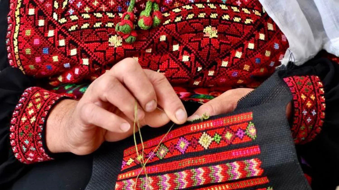 A women doing Tatreez, a traditional form of embroidery in Palestine