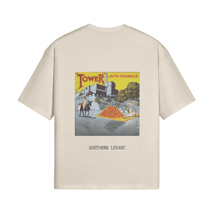 A mockup of the sand-colored Jaffa Oranges T-Shirt from FALASTIN, showcasing a bold back design that celebrates the legacy of Jaffa oranges with a vintage-inspired illustration and the words “Southern Levant.” This design pays tribute to the cultural and agricultural heritage of Palestine.