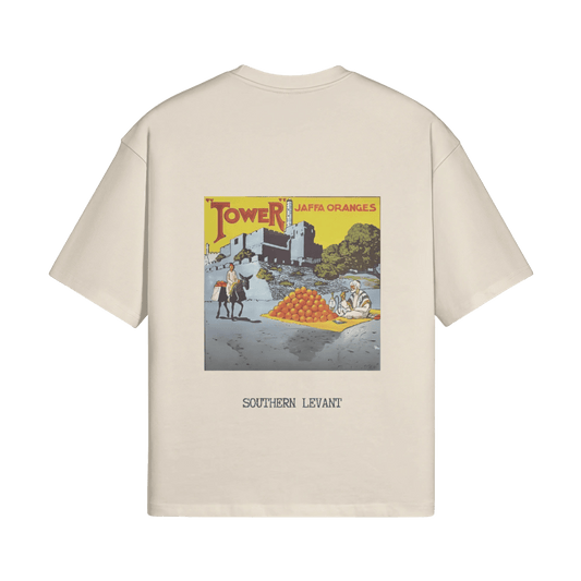 A mockup of the sand-colored Jaffa Oranges T-Shirt from FALASTIN, showcasing a bold back design that celebrates the legacy of Jaffa oranges with a vintage-inspired illustration and the words “Southern Levant.” This design pays tribute to the cultural and agricultural heritage of Palestine.